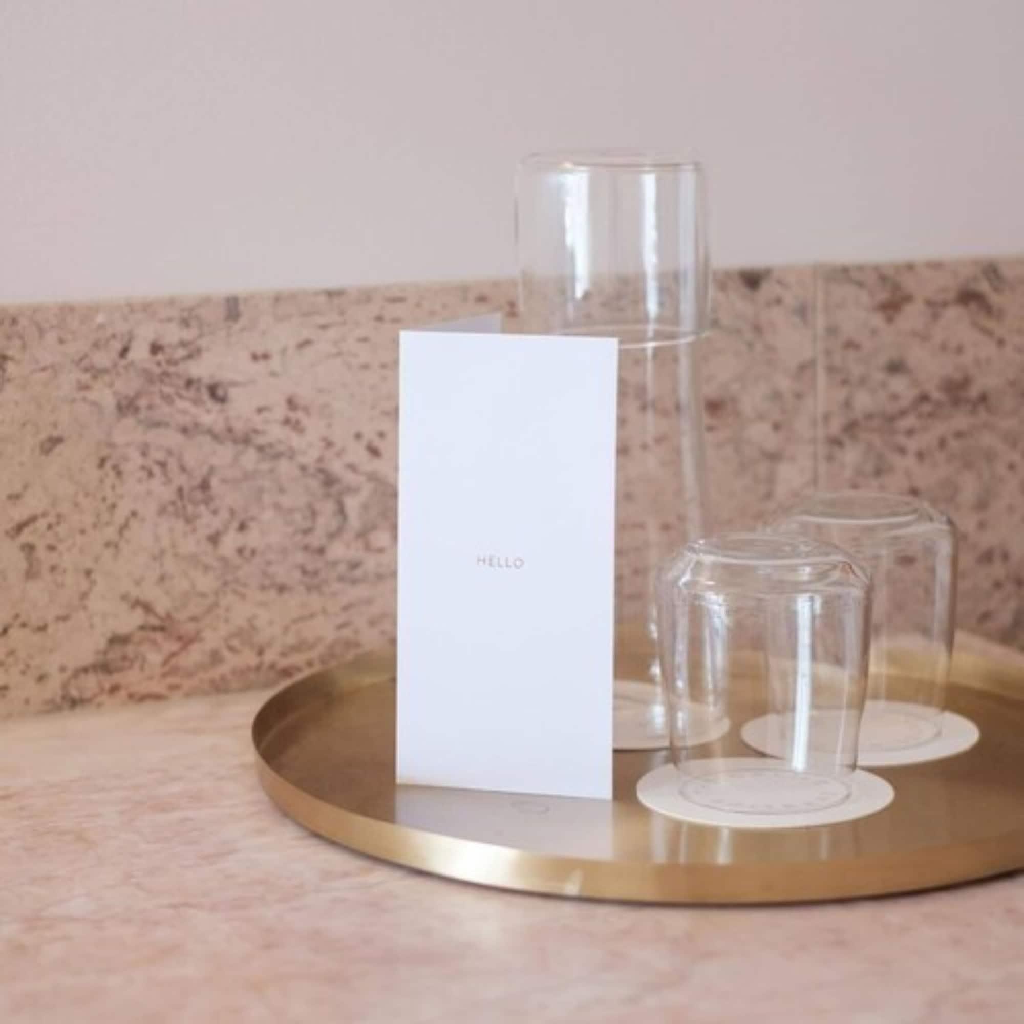The Calile Hotel Brisbane Esterno foto A tray of water and glasses at a hotel